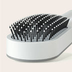 Gros plan sur les picots souples de la brosse NOVIA blanche [Blanc]