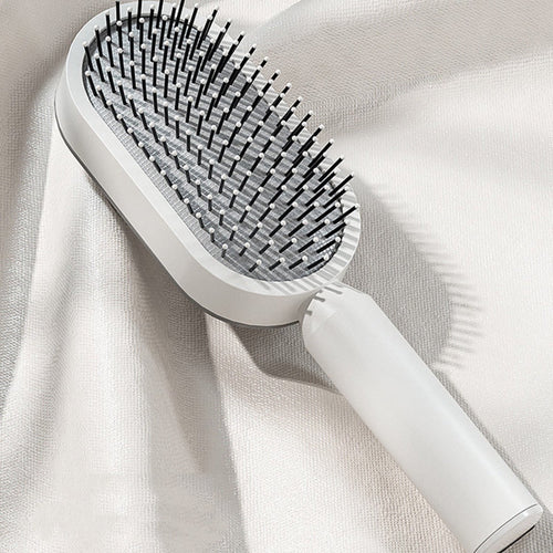 Brosse NOVIA blanche posée sur un tissu clair [Blanc]